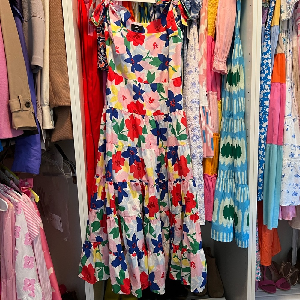Beautiful dress. Worn once and dry cleaned. Tie bows on shoulders.